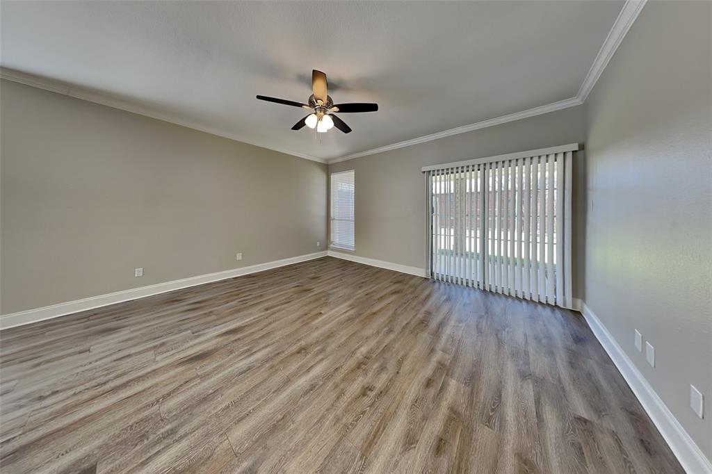 806 Kipling Drive Allen, TX 75002 - Photo 3 of 19 a view of empty room with wooden floor and fan