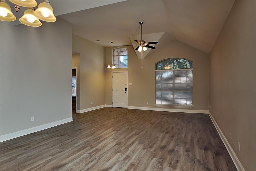 806 Kipling Drive Allen, TX 75002 - Photo 4 of 19 a view of an empty room with wooden floor and a window