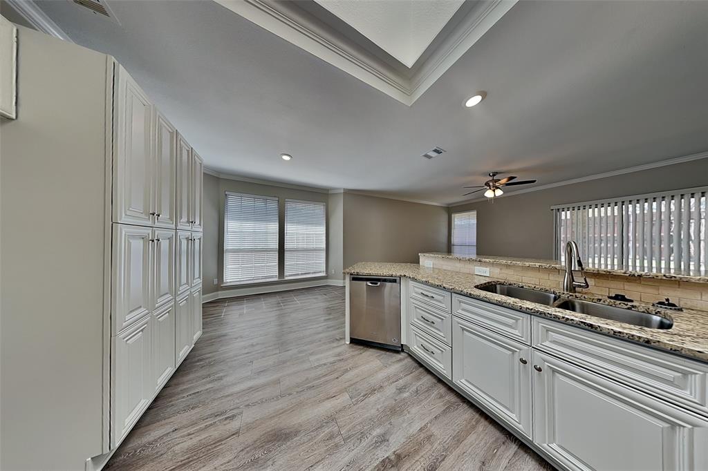 806 Kipling Drive Allen, TX 75002 - Photo 6 of 19 a large kitchen with a lot of counter space and wooden floor