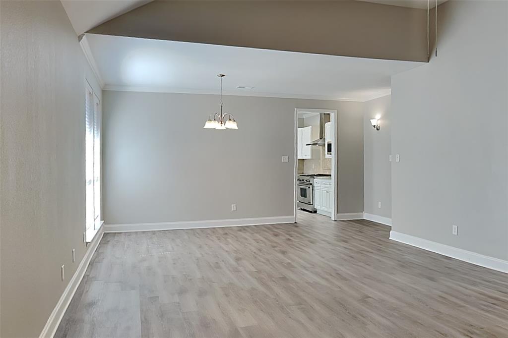 806 Kipling Drive Allen, TX 75002 - Photo 9 of 19 an empty room with wooden floor and windows
