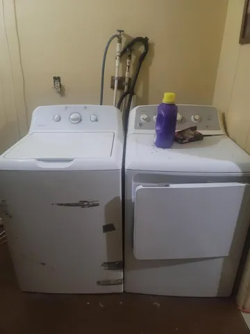 a room with a stove and a table