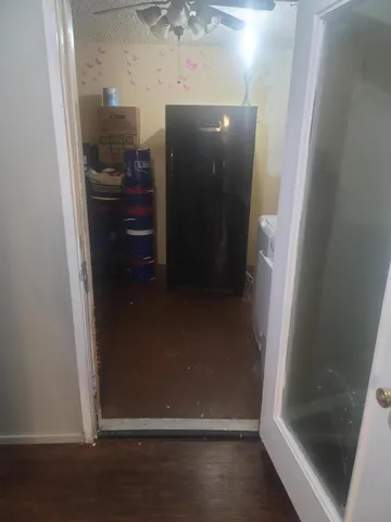 a room with furniture and a wooden floor