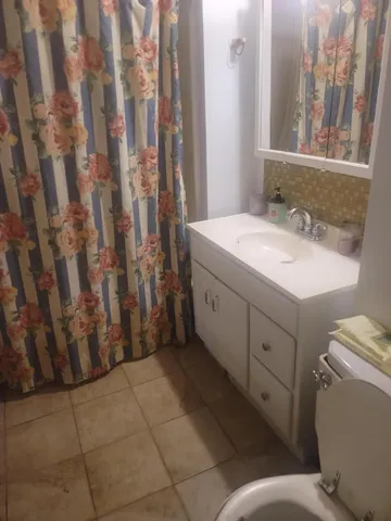 a bathroom with a toilet and a sink