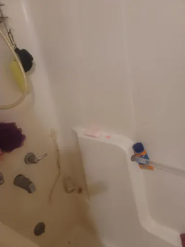 a bathroom with a toilet and a sink