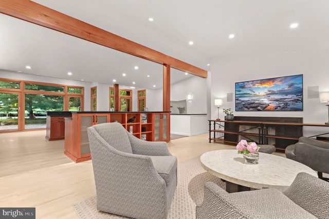 a view of a room with furniture and front door