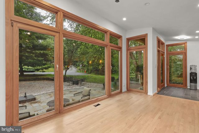 a kitchen with stainless steel appliances granite countertop a sink and a microwave