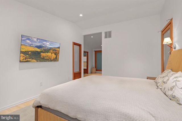 a view of a house with backyard and a tree