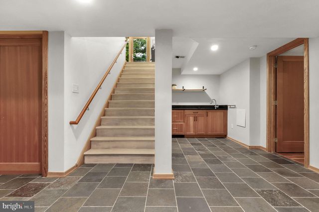 a view of a couches in backyard of house