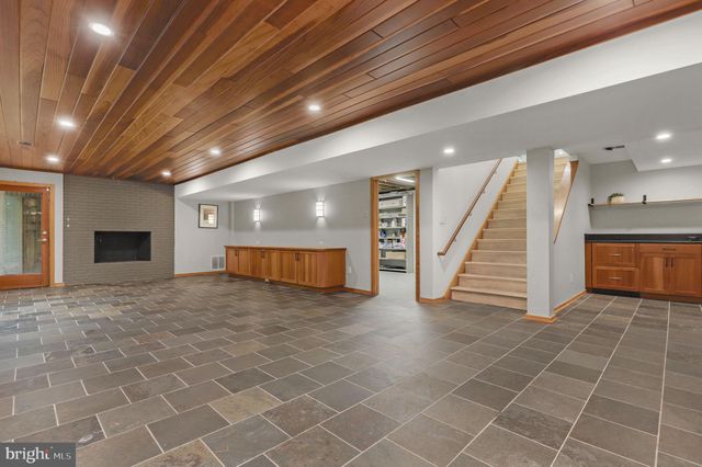 a view of a room with wooden walls