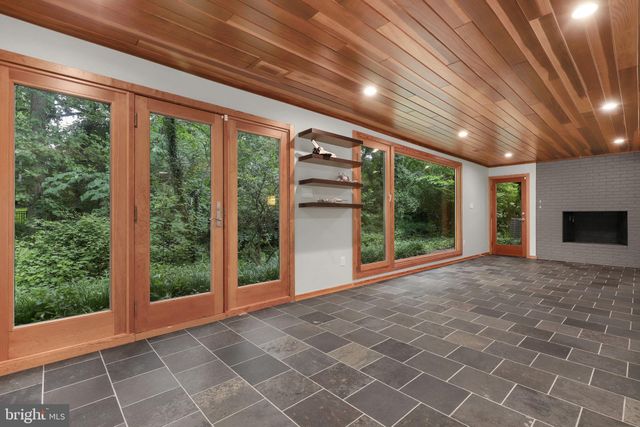 a view of a pathway both side of house