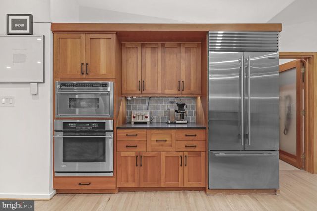 a lobby with furniture and a large mirror