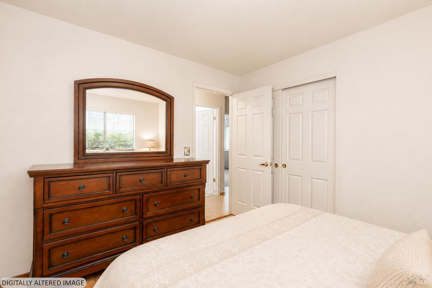 1935 Seville Street Santa Rosa, CA 95403 - Photo 18 of 30 a bedroom with a bed and a mirror on dresser