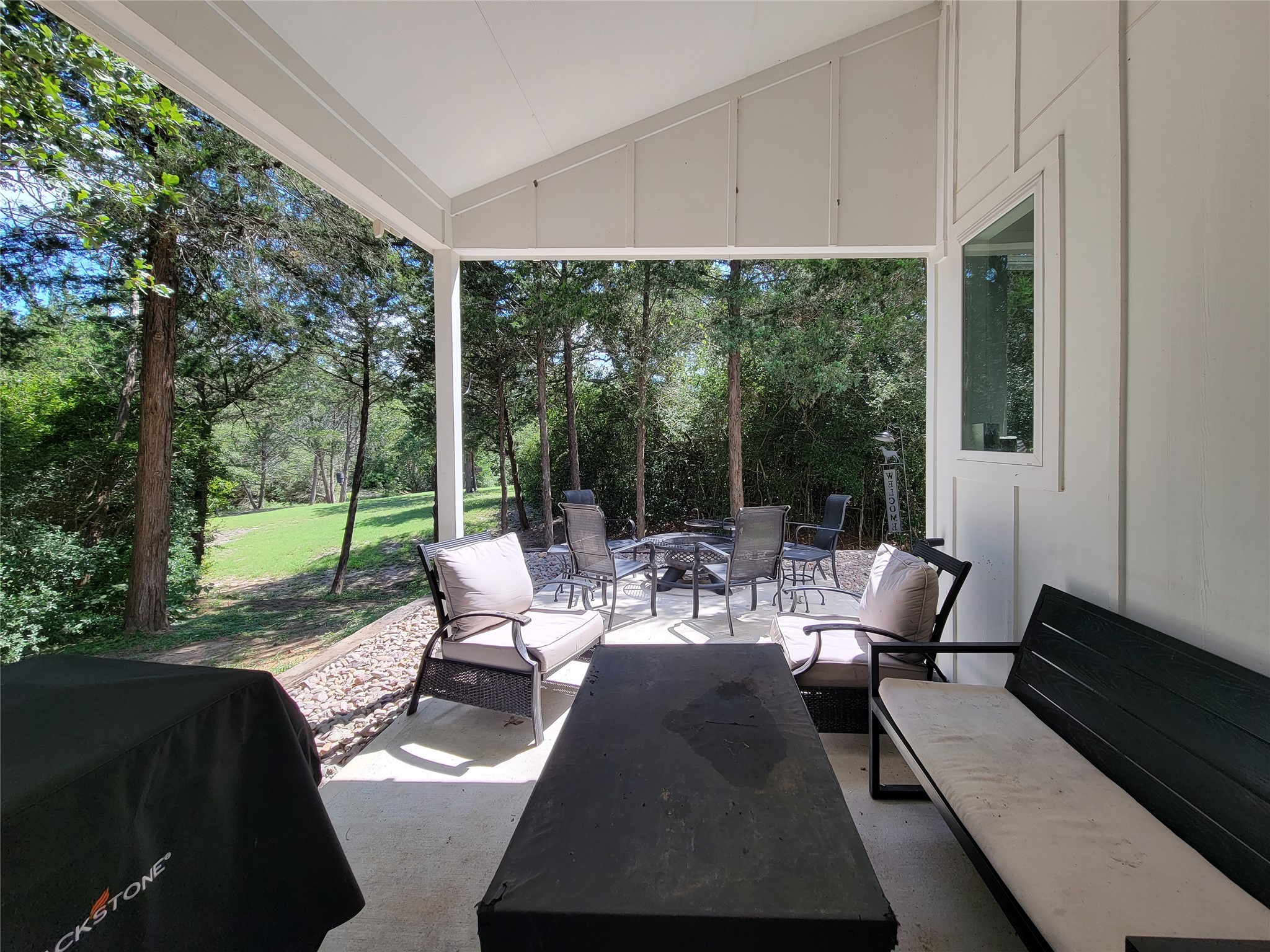 4937 Wolff Road Round Top, TX 78954 - Photo 8 of 31 Charming entryway with a cozy covered patio, perfect for relaxing and enjoying the outdoors.