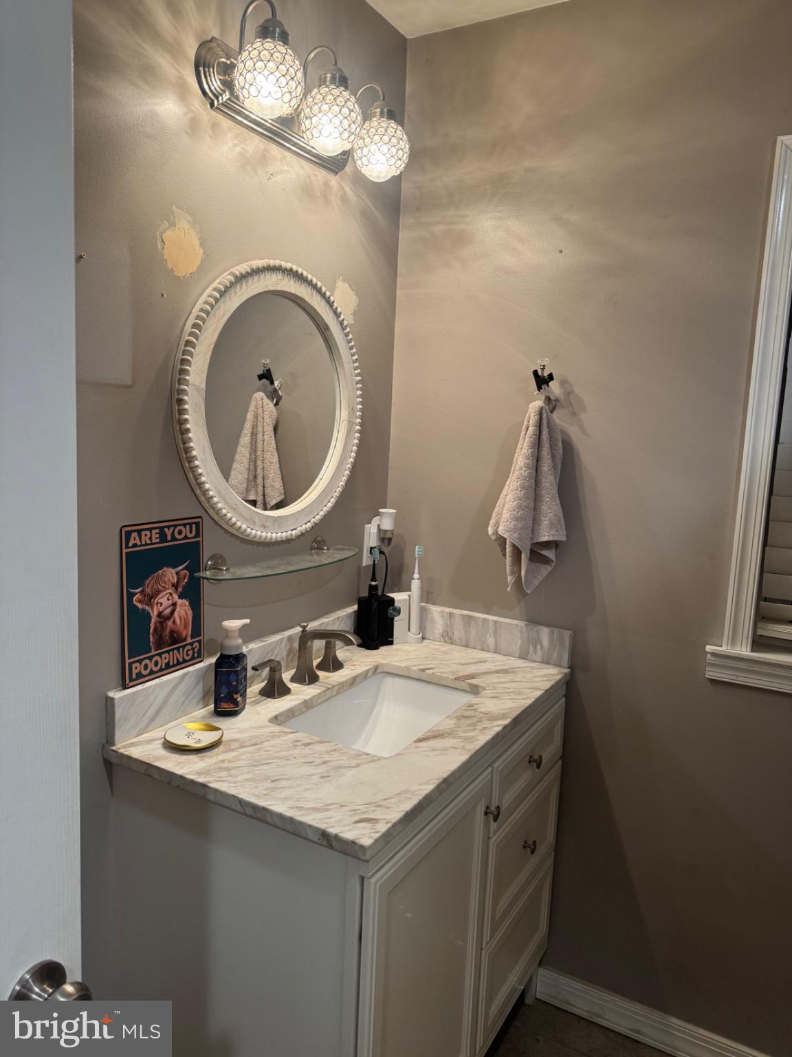 32 Alden Avenue Delran, NJ 08075 - Photo 11 of 13 a bathroom with a sink and a mirror