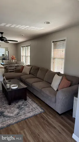a living room with furniture and a rug