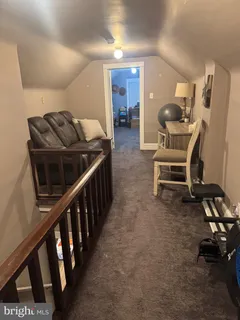 a living room with furniture and a chair