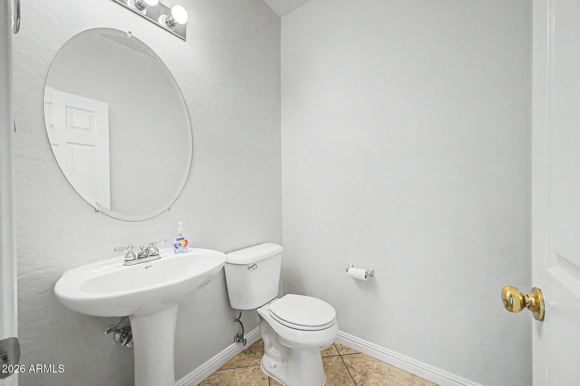 45449 West Tucker Road Maricopa, AZ 85139 - Photo 12 of 46 a bathroom with a sink mirror and toilet