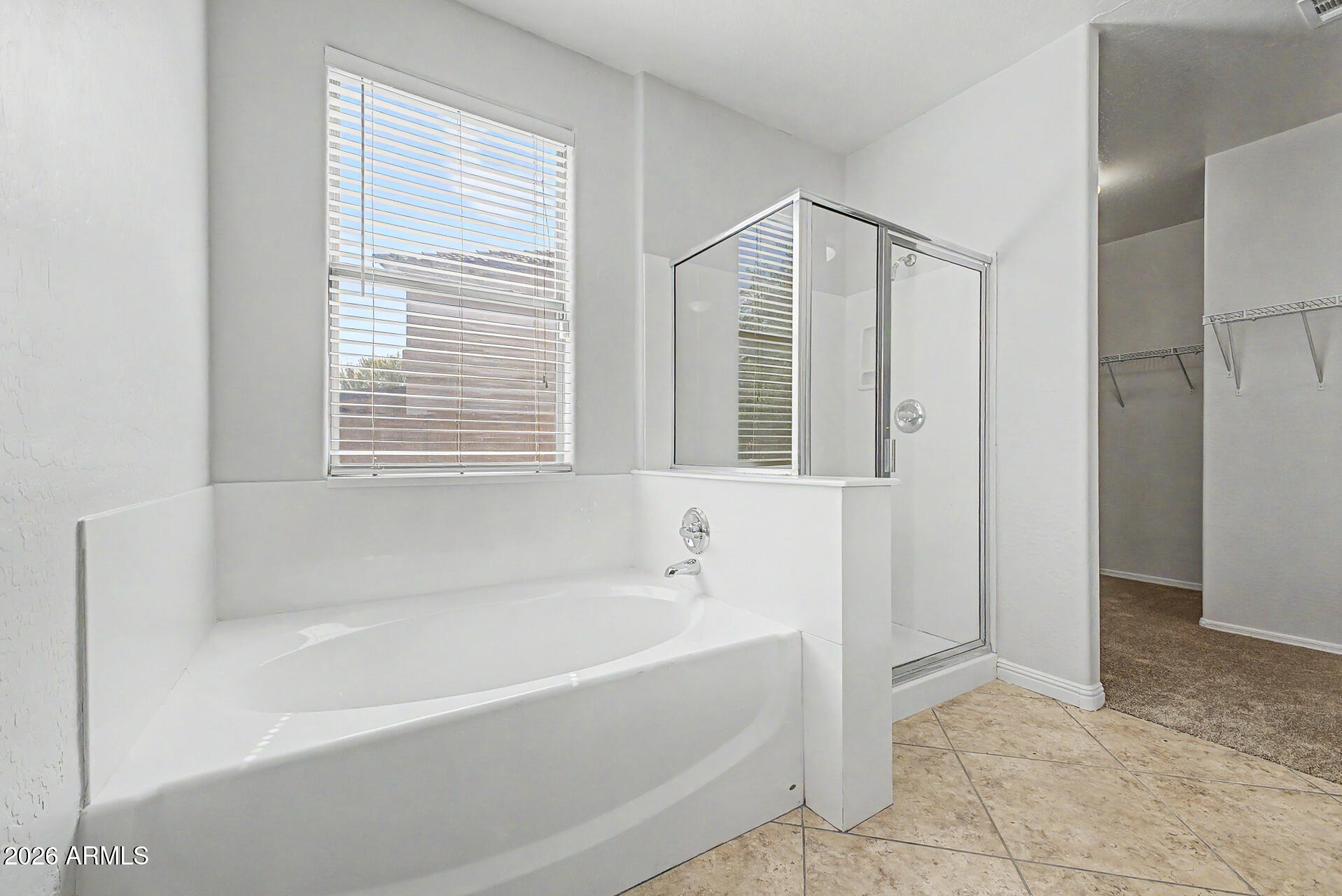 45449 West Tucker Road Maricopa, AZ 85139 - Photo 14 of 46 a spacious bathroom with bathtub and shower