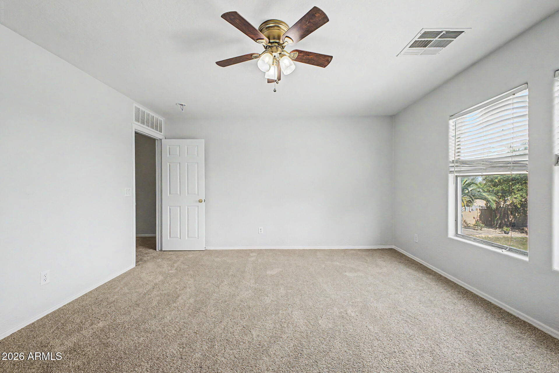 45449 West Tucker Road Maricopa, AZ 85139 - Photo 32 of 46 an empty room with windows and fan
