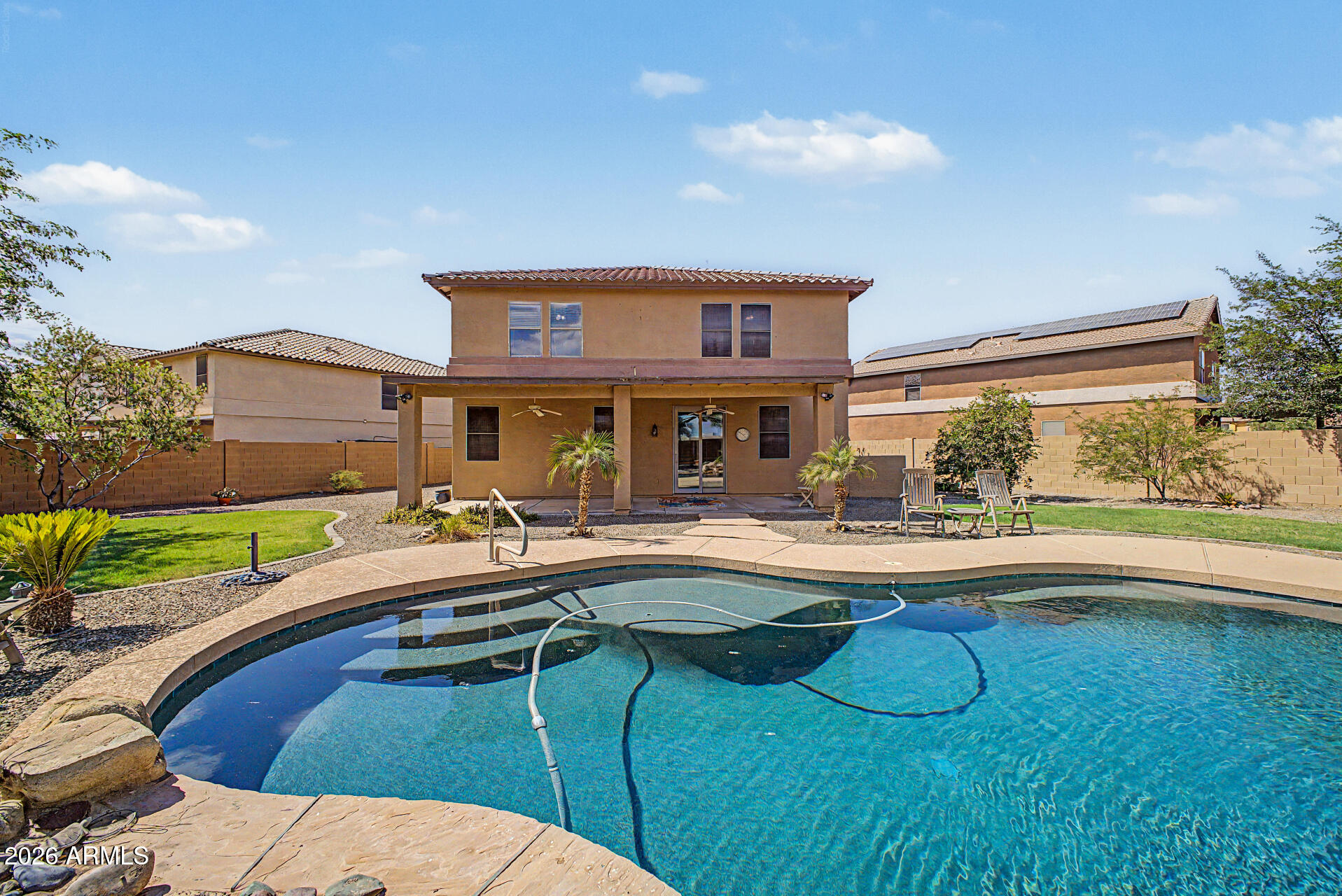 45449 West Tucker Road Maricopa, AZ 85139 - Photo 37 of 46 a view of a house with swimming pool and sitting area