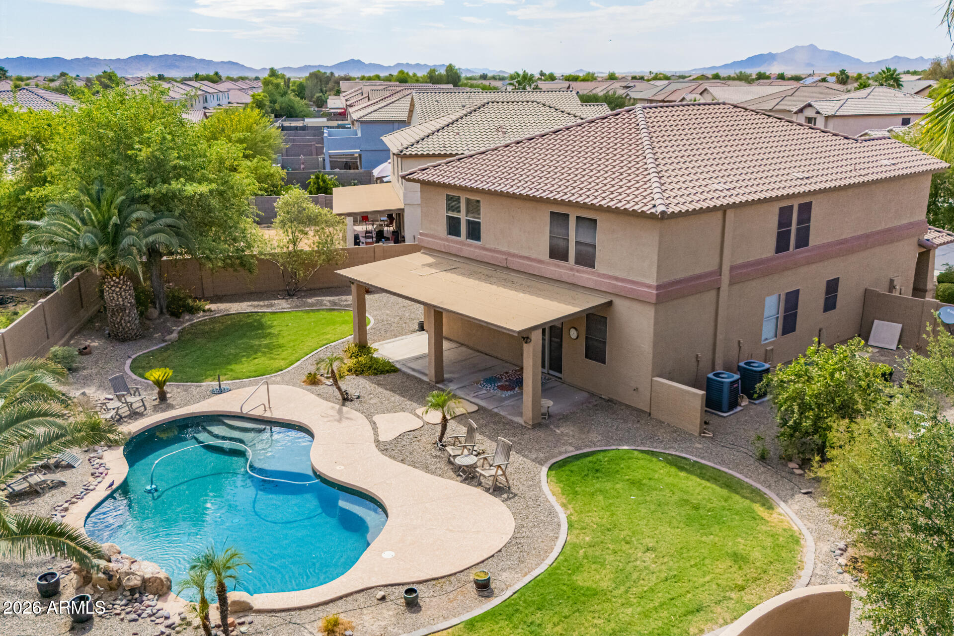 45449 West Tucker Road Maricopa, AZ 85139 - Photo 38 of 46 an aerial view of a house with swimming pool garden and patio