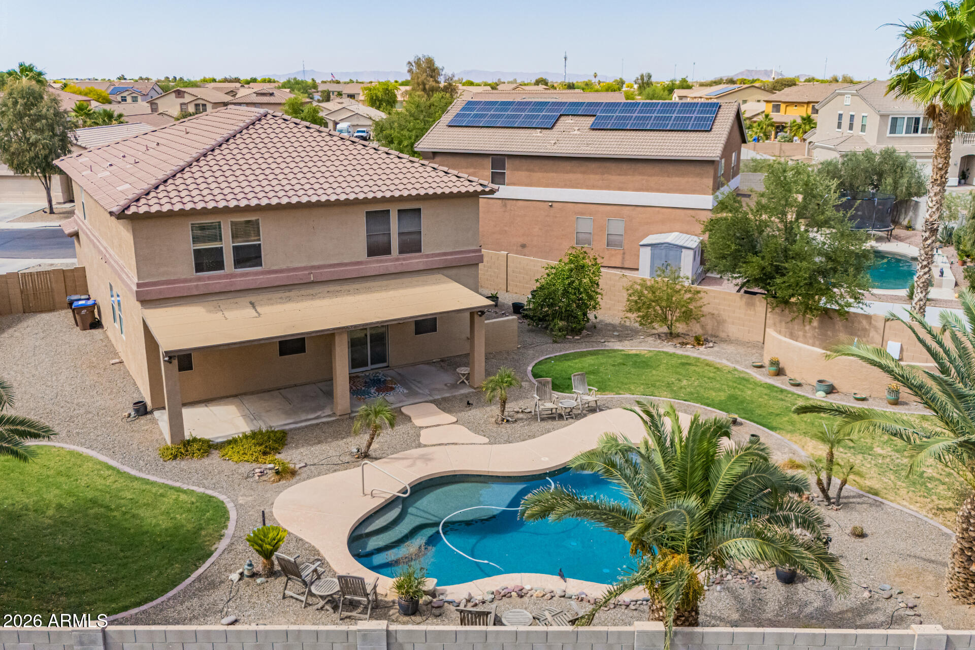 45449 West Tucker Road Maricopa, AZ 85139 - Photo 39 of 46 a view of a house with backyard and sitting area