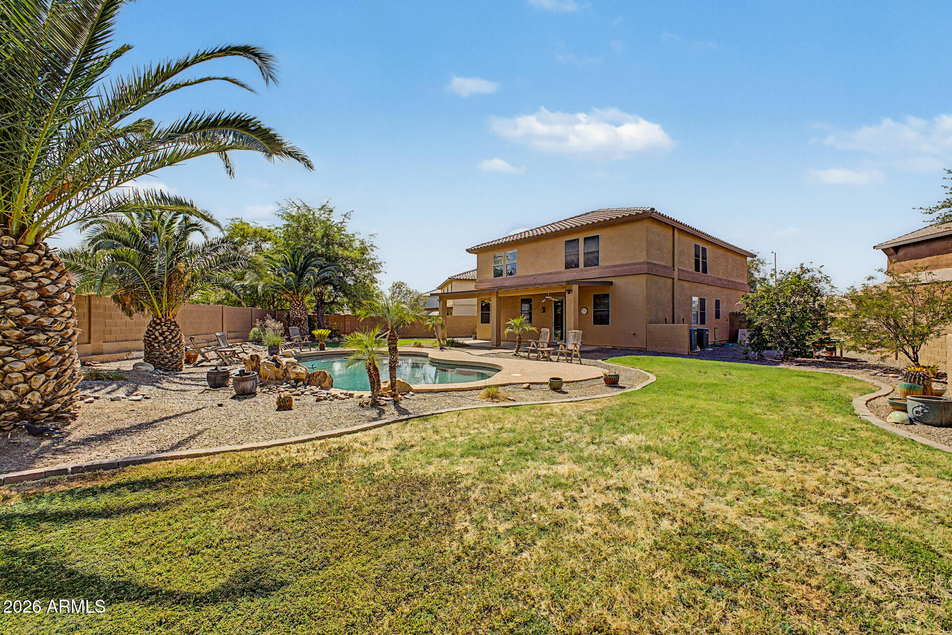 45449 West Tucker Road Maricopa, AZ 85139 - Photo 42 of 46 a front view of a house with swimming pool