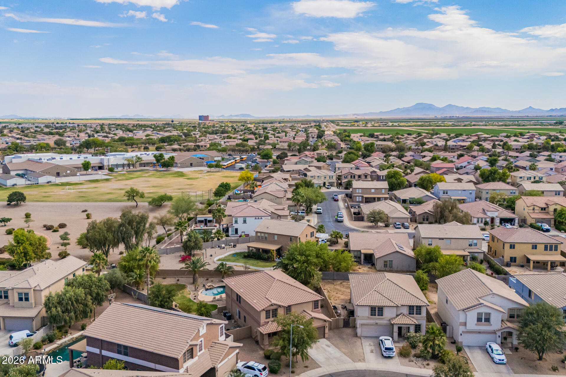 45449 West Tucker Road Maricopa, AZ 85139 - Photo 44 of 46 an aerial view of a city with lots of residential buildings and ocean view in back