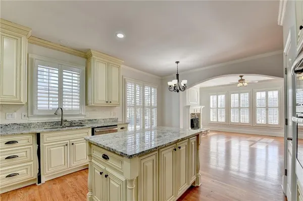 a spacious bathroom with a bathtub sink and mirror