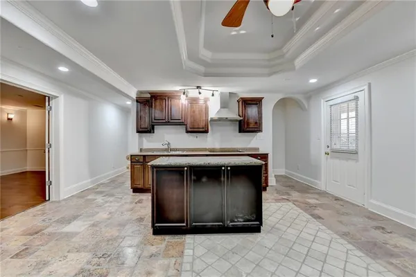 a view of balcony with wooden floor and fence and a floor to ceiling window
