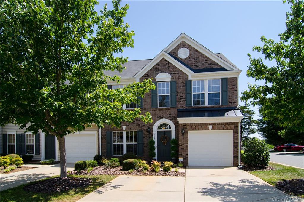207 Snead Road, Unit 207 Fort Mill, SC 29715 - Photo 1 of 19 a front view of a house with garden