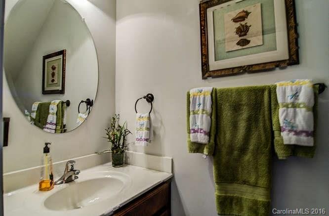 207 Snead Road, Unit 207 Fort Mill, SC 29715 - Photo 11 of 19 a bathroom with a sink and mirror