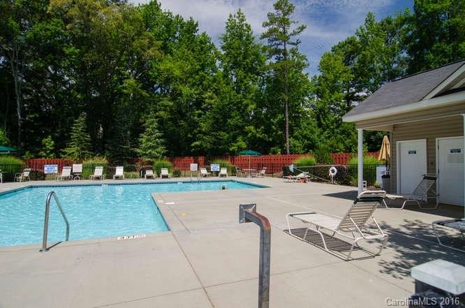 207 Snead Road, Unit 207 Fort Mill, SC 29715 - Photo 19 of 19 a view of a patio with table and chairs potted plants and large tree