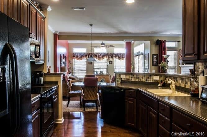 207 Snead Road, Unit 207 Fort Mill, SC 29715 - Photo 4 of 19 a kitchen with lots of counter top space and stainless steel appliances