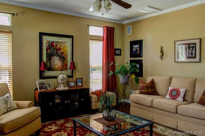 207 Snead Road, Unit 207 Fort Mill, SC 29715 - Photo 8 of 19 a living room with furniture and a lamp