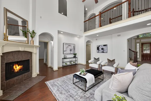 a living room with furniture and a fireplace