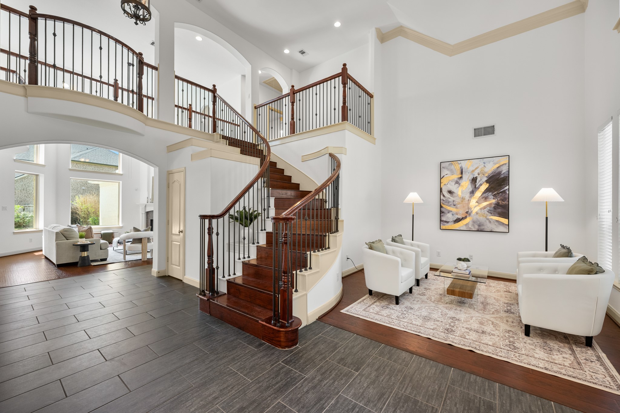 4603 Red Hawk Court Sugar Land, TX 77479 - Photo 5 of 50 a living room with couches and stairs with wooden floor