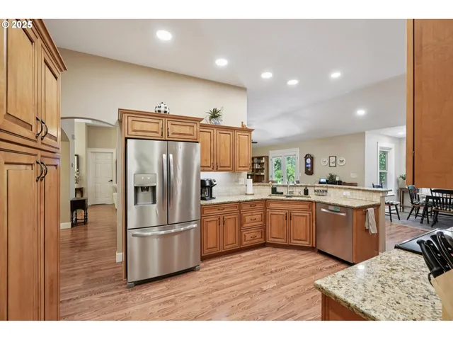 a kitchen with refrigerator and microwave