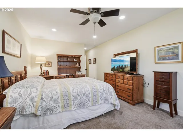 a bed room with a bed and a television