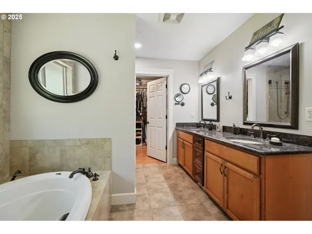 a bathroom with a granite countertop sink a mirror and a
