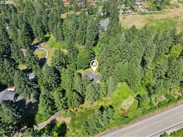 an aerial view of a houses with yard