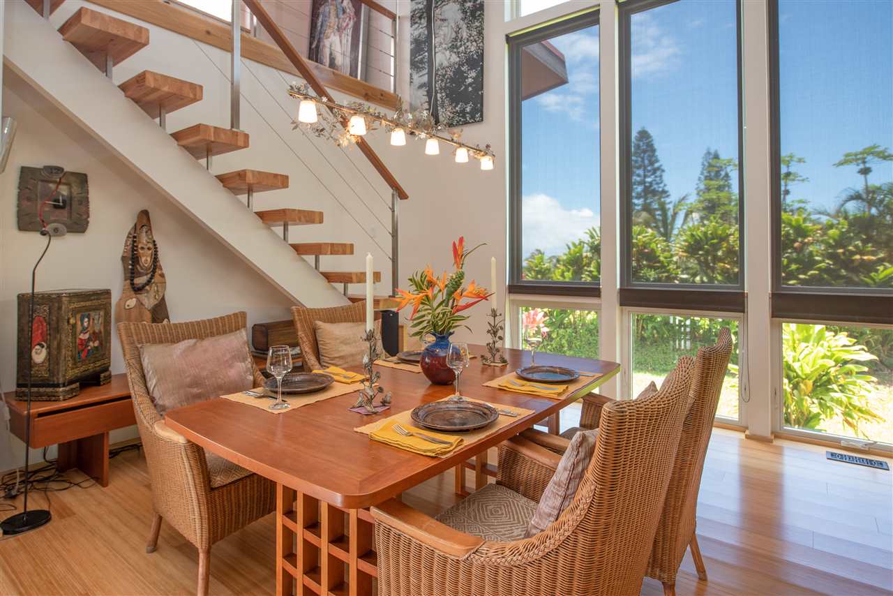 525 North Honokala Road Haiku, HI 96708 - Photo 1 of 30 a dining room with furniture large windows and wooden floor