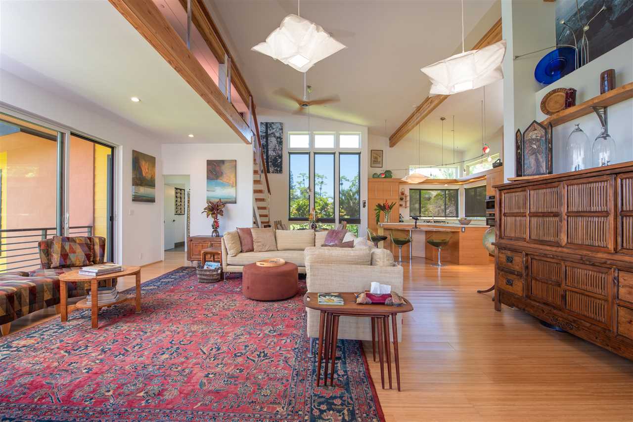 525 North Honokala Road Haiku, HI 96708 - Photo 7 of 30 a living room with furniture fireplace and large windows