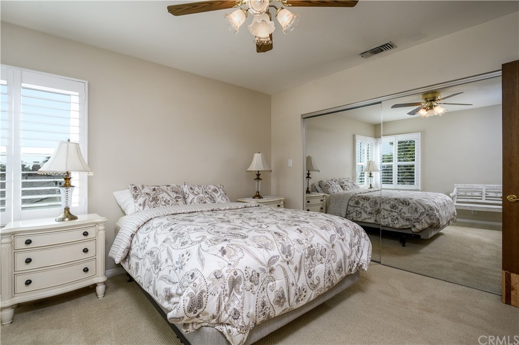 12430 Beverly Drive Whittier, CA 90601 - Photo 15 of 31 a bedroom with a bed and a chandelier