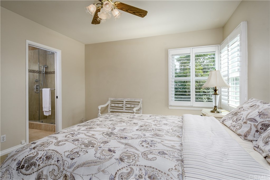 12430 Beverly Drive Whittier, CA 90601 - Photo 16 of 31 a bedroom with a large bed and a window