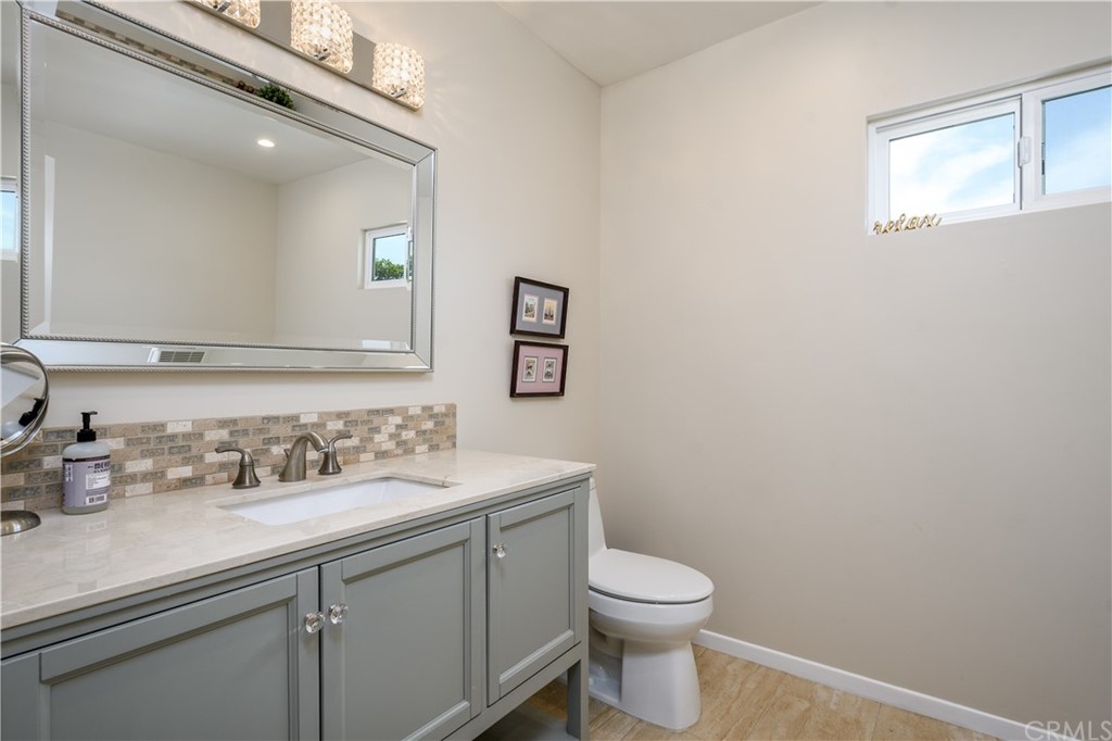 12430 Beverly Drive Whittier, CA 90601 - Photo 20 of 31 a bathroom with a toilet sink and mirror