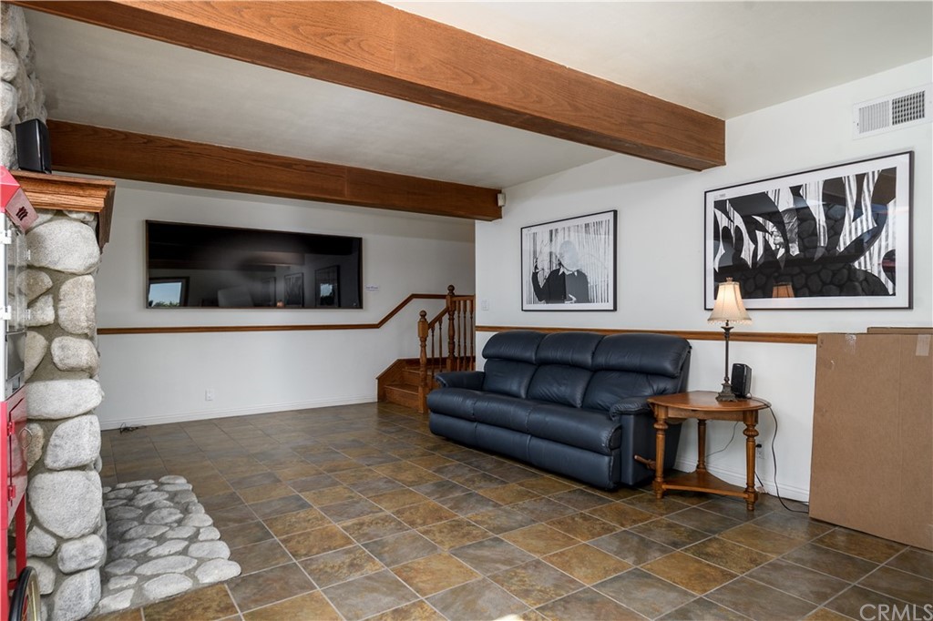 12430 Beverly Drive Whittier, CA 90601 - Photo 23 of 31 a living room with furniture and a flat screen tv