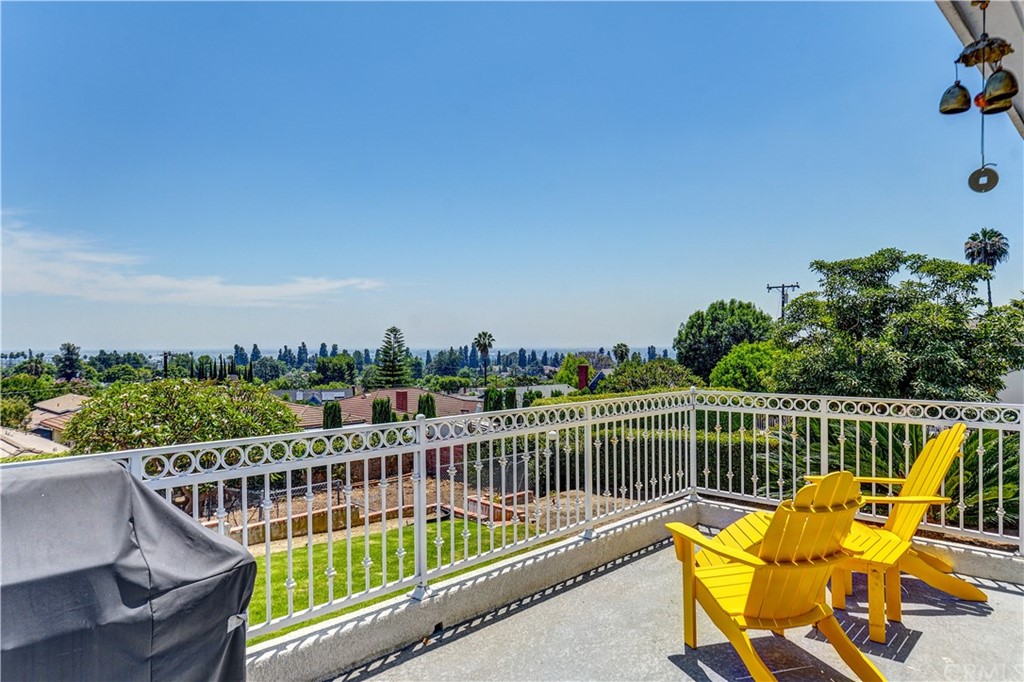 12430 Beverly Drive Whittier, CA 90601 - Photo 26 of 31 a view of a balcony with wooden chairs