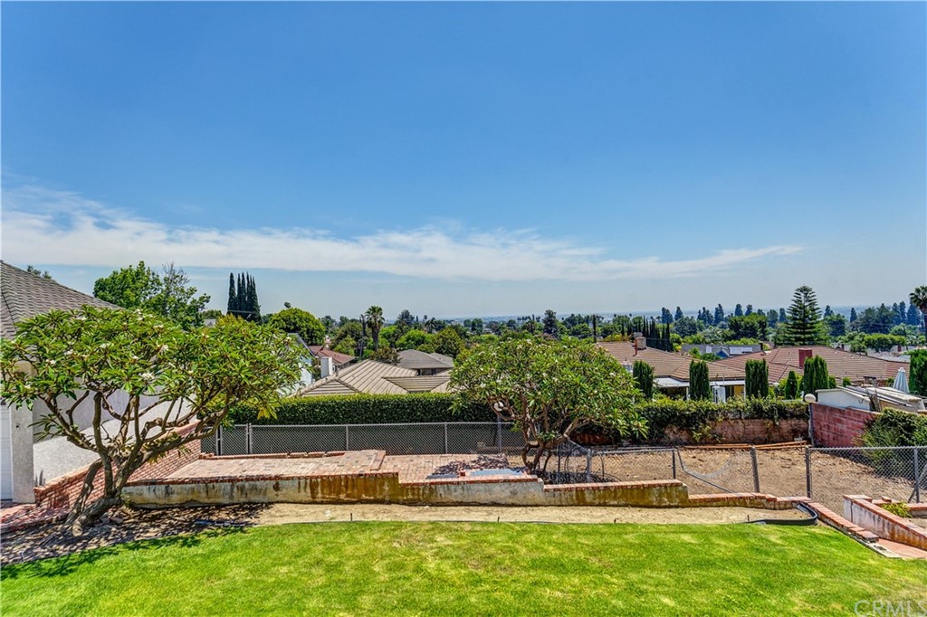 12430 Beverly Drive Whittier, CA 90601 - Photo 28 of 31 a view of a swimming pool with a yard and lake view