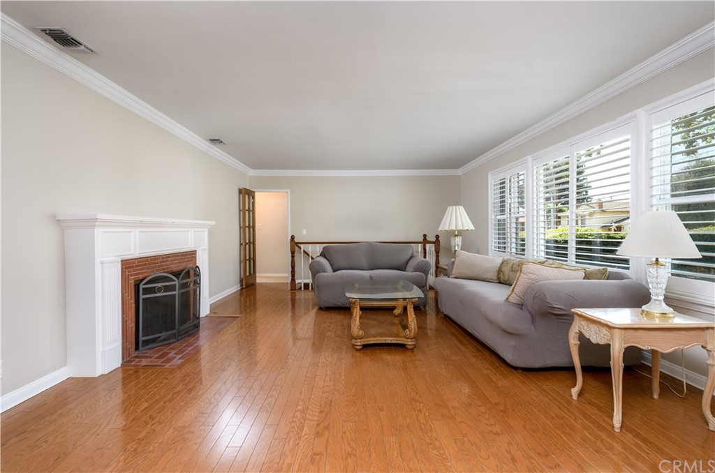 12430 Beverly Drive Whittier, CA 90601 - Photo 4 of 31 a living room with furniture and a fireplace